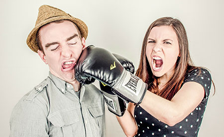 stock image of woman punching man