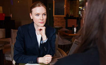 stock image of woman in meeting