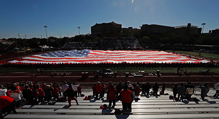 Veterans unveil American flag during Military Appreciation night at UIW football game