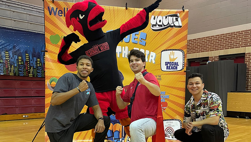 Red the Cardinal with students