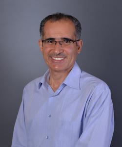 A headshot of Dr. Suleyman Tek