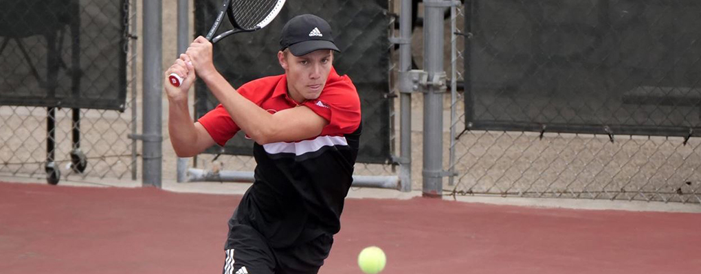 A UIW men's tennis player on the court