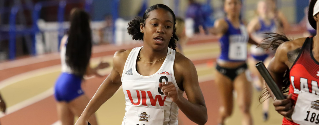 A UIW student runs on the track