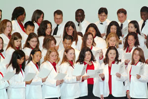 The Feik School of Pharmacy’s inaugural class of 2010 recites an oath of professionalism.  Students represent diverse ages and cultures.