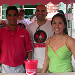 Tony Ramos ’02 BS, Luis Vasquez ’97 BBA and Berenice Villamil ’06 BA at the alumni margarita booth