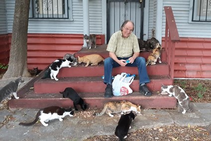 Louis P. Lubbering (1944-2020) feeding cats