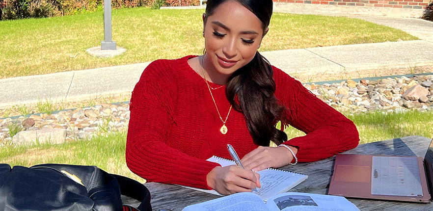 Student studying on campus