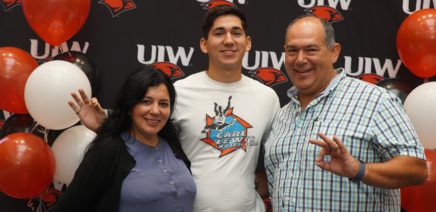 Freshman student and his parents at Orientation