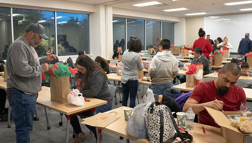 Parents assembling care packages