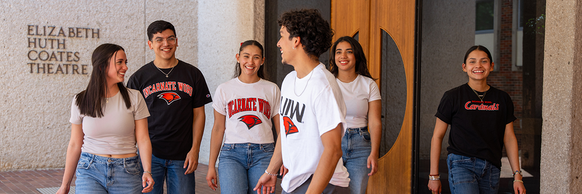Six students walking outside of Coates Theatre