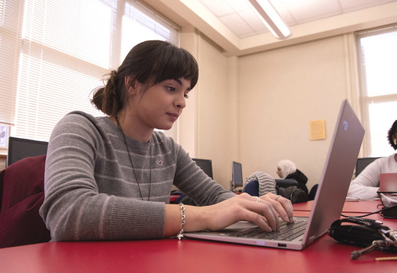 UIW Student with a laptop