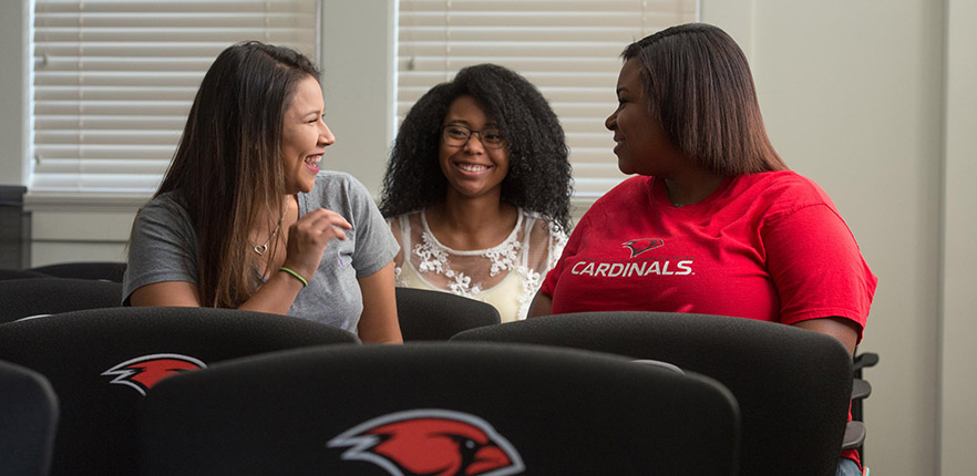 three students chatting