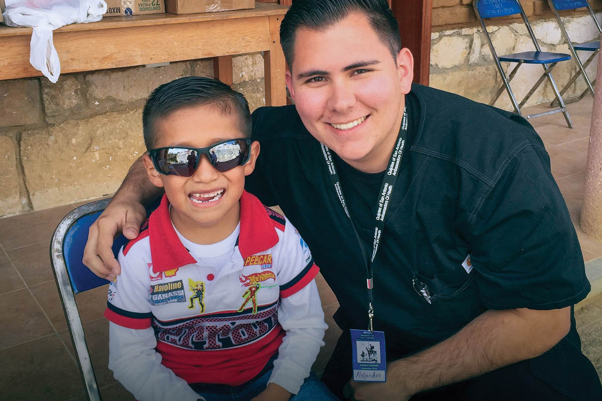 Student smiling with patient