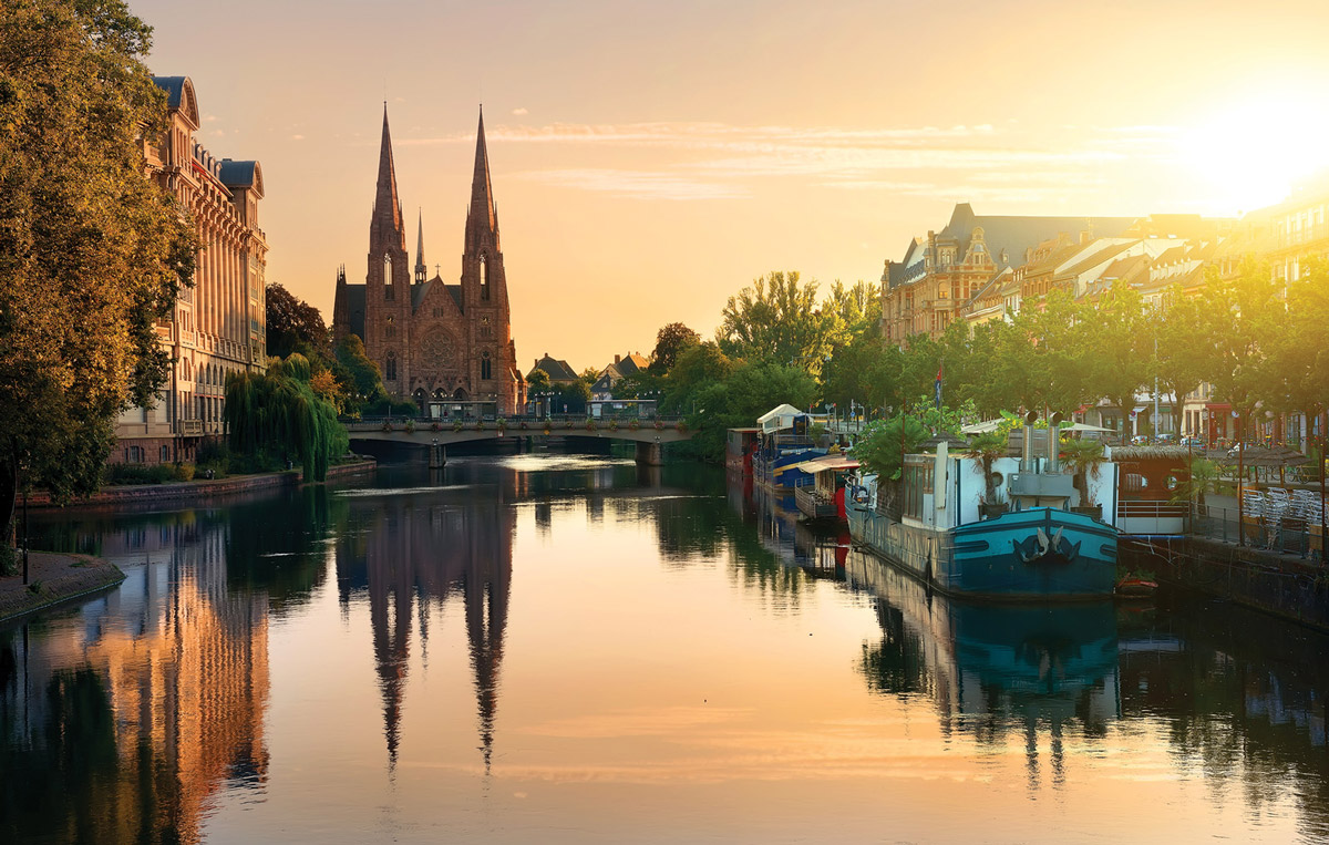 photo of riverside cathedral in France