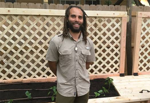 Stephen Lucke standing in his garden