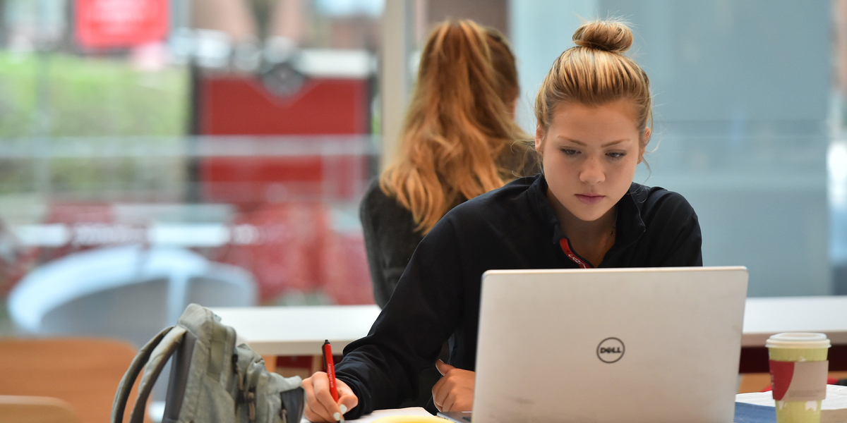 student using laptop in study area