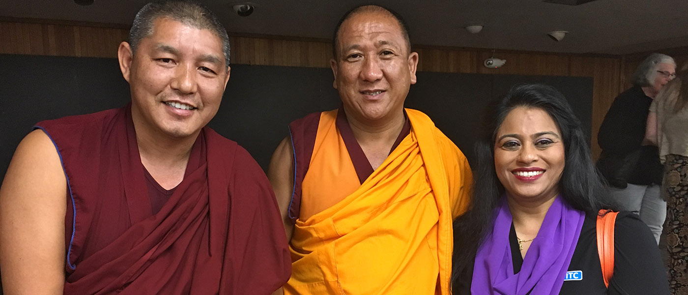 Asian Studies professor with two Tibetan monks