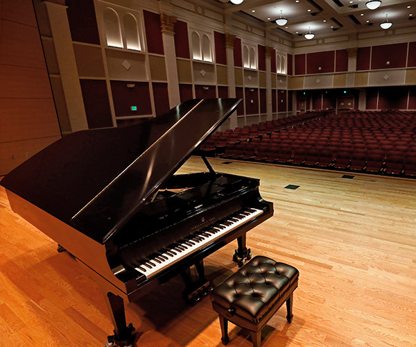 Concert piano on stage at the university theatre