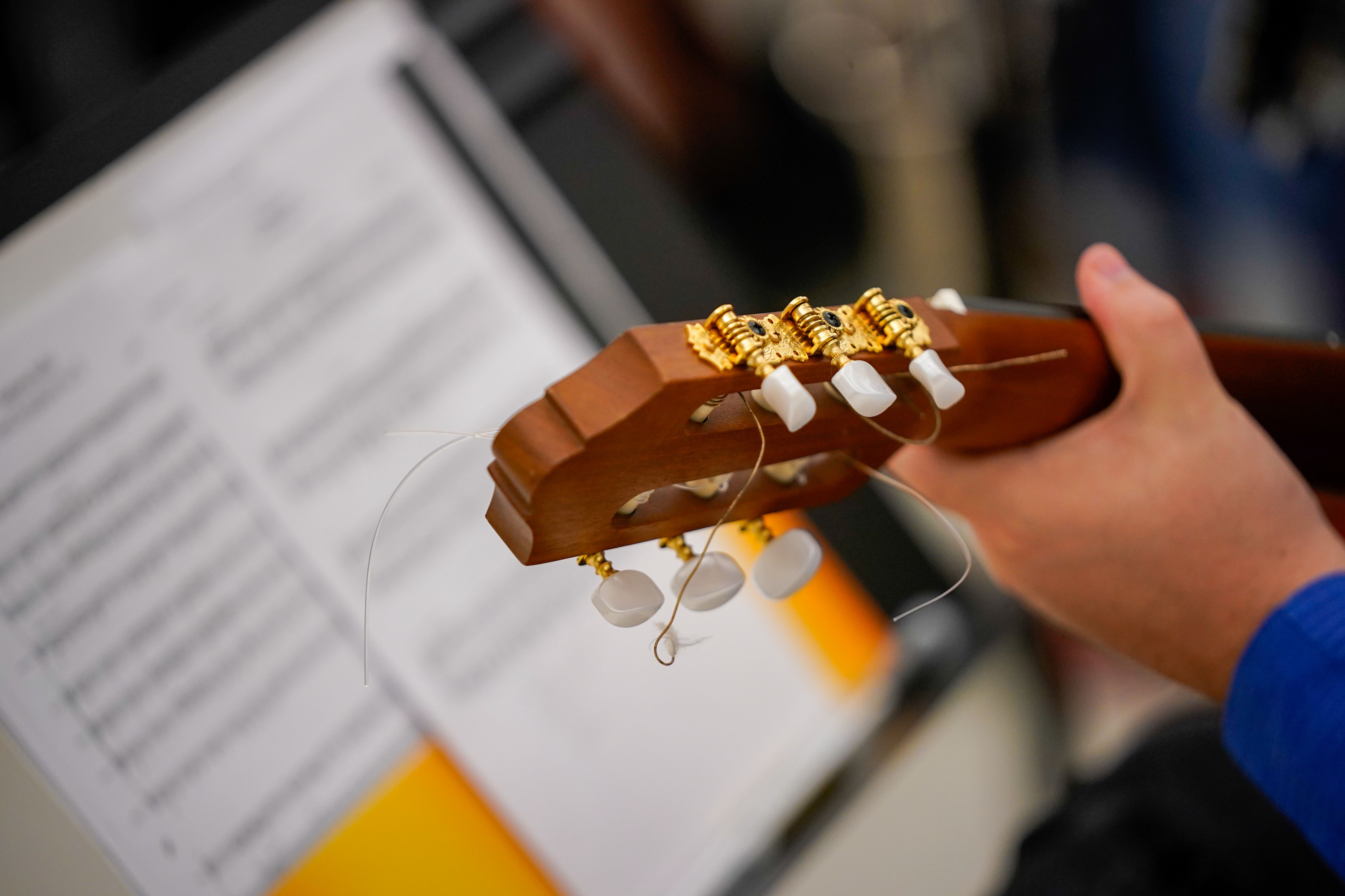 Student Playing Guitar