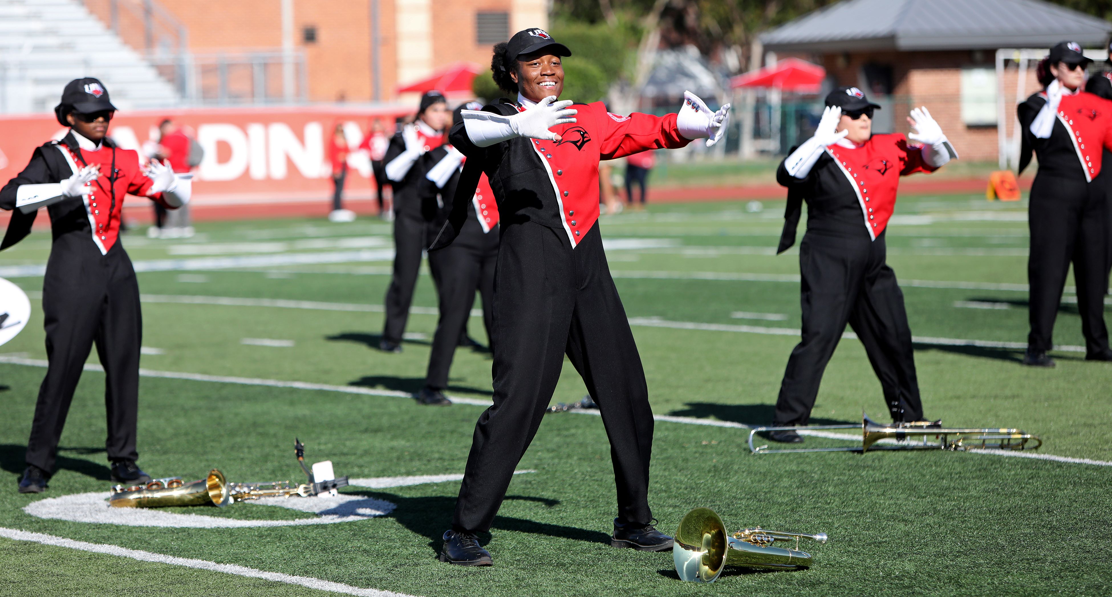 Marching Band Members Dancing on the football field