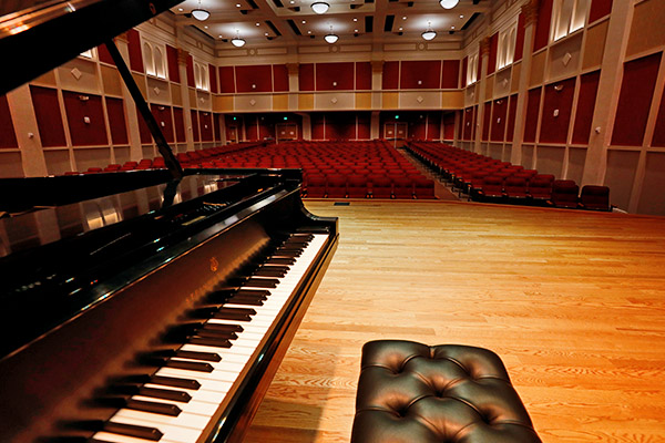 Featured image of a concert piano up on stage