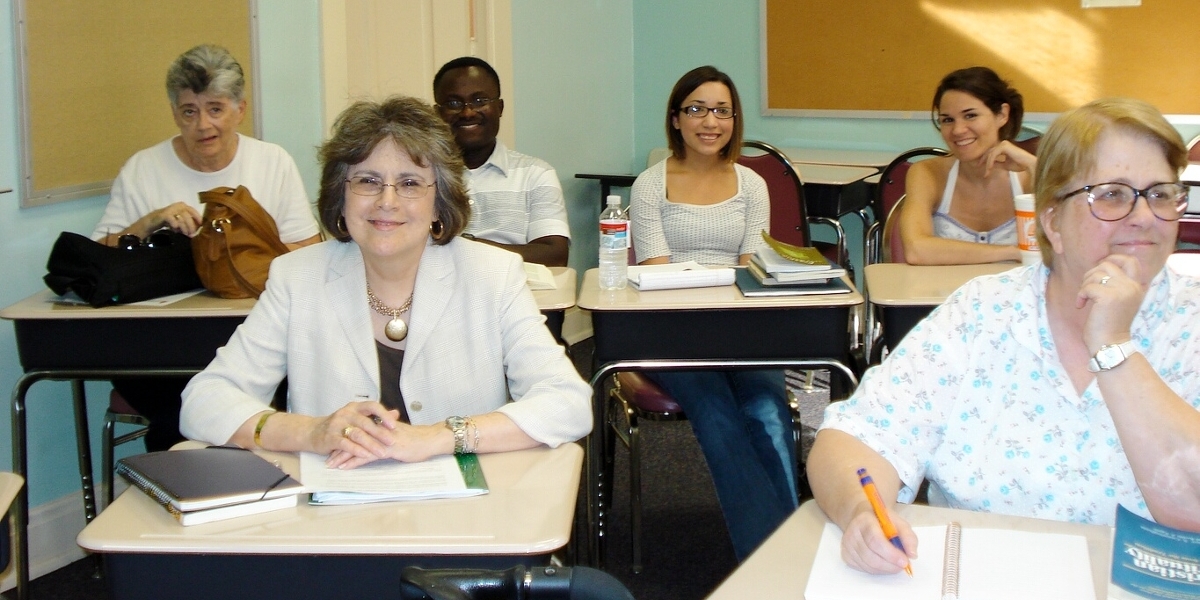 Pastoral Ministry classroom with a group of smiling students