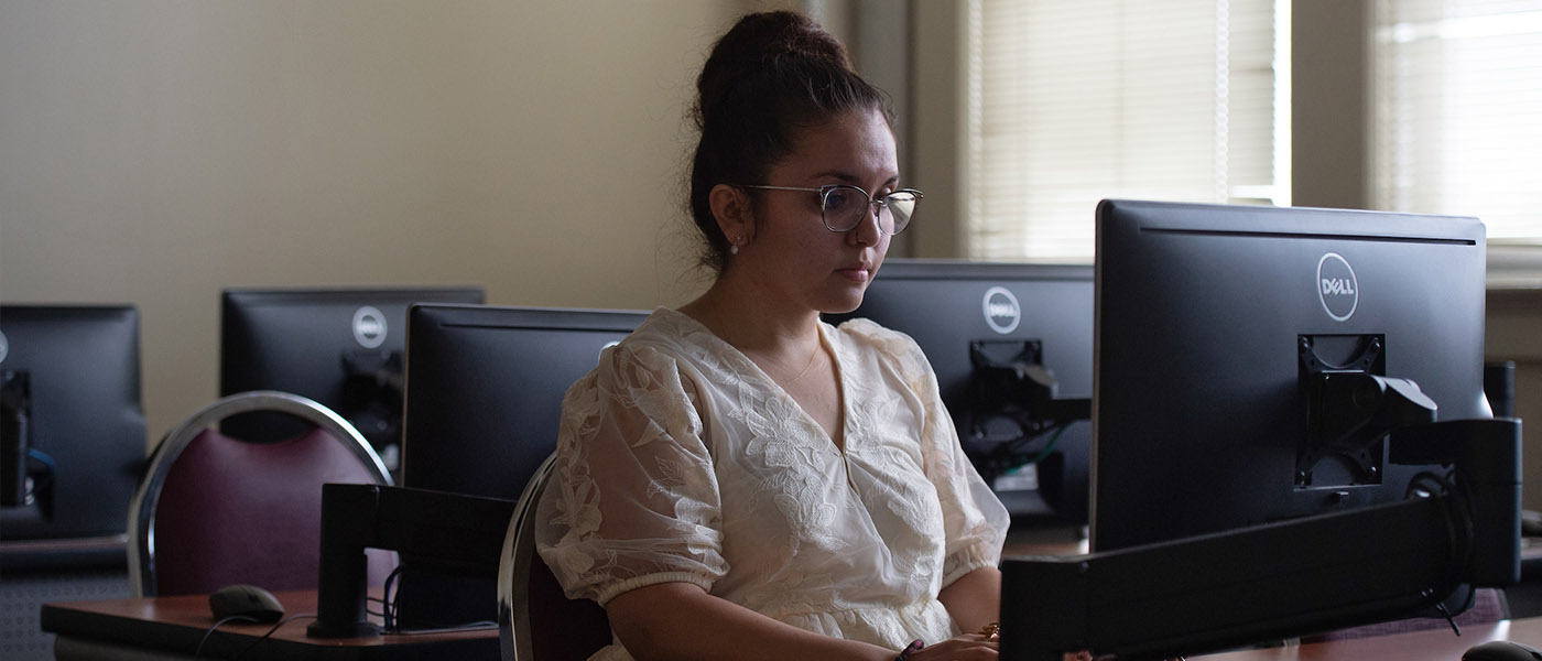 Psychology student working in a computer lab