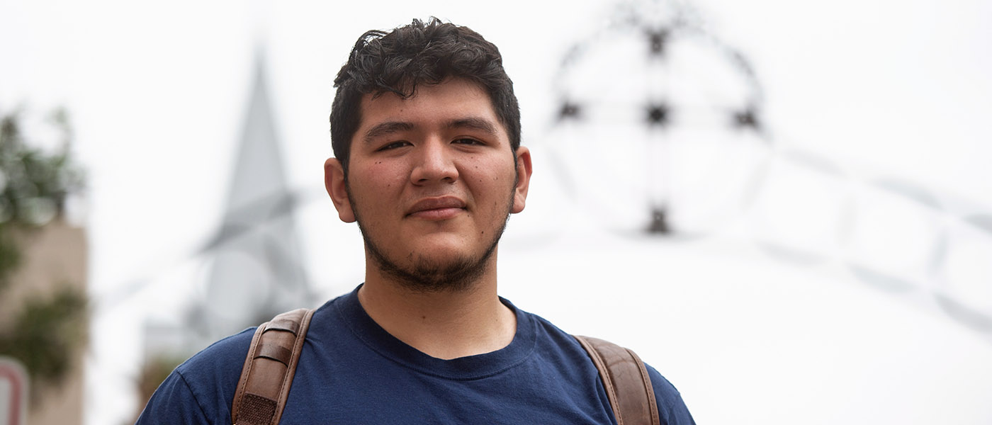 Ministry student close up with crucifix in the background