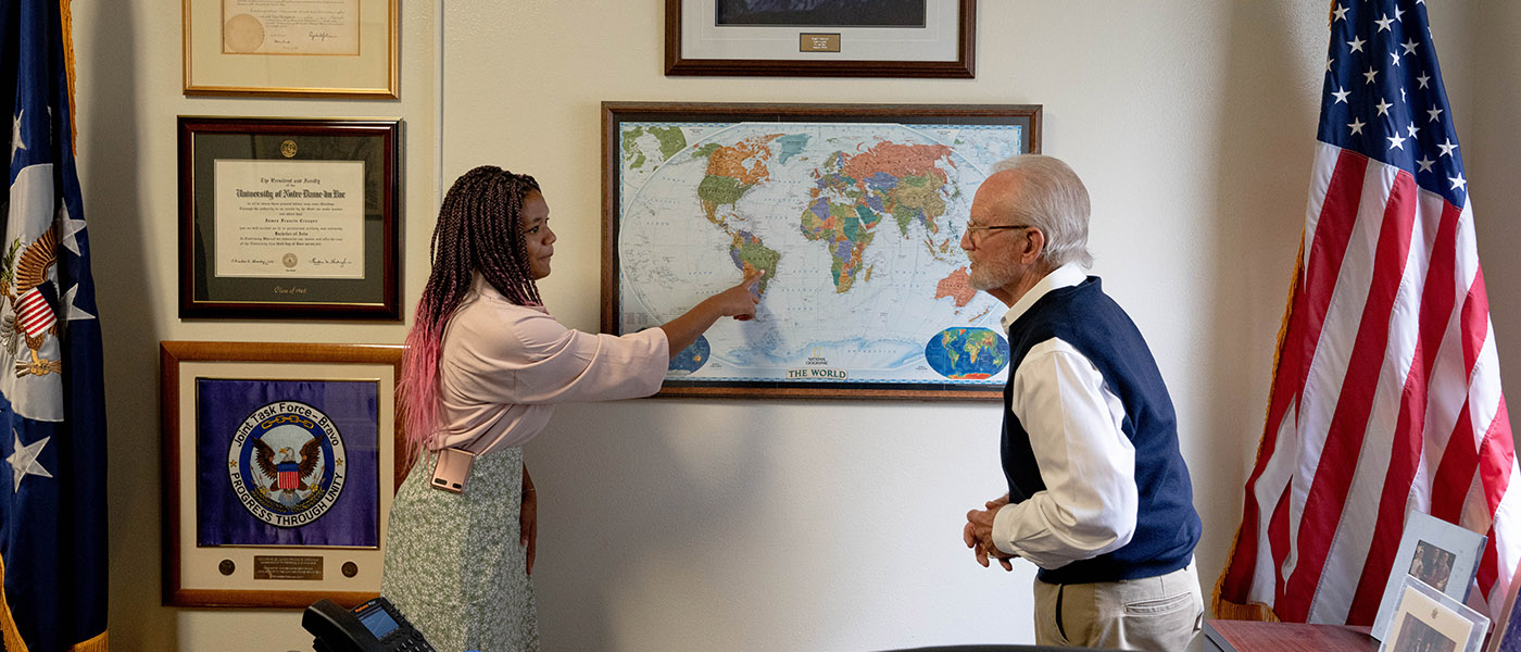 Student speaking with international affairs professor