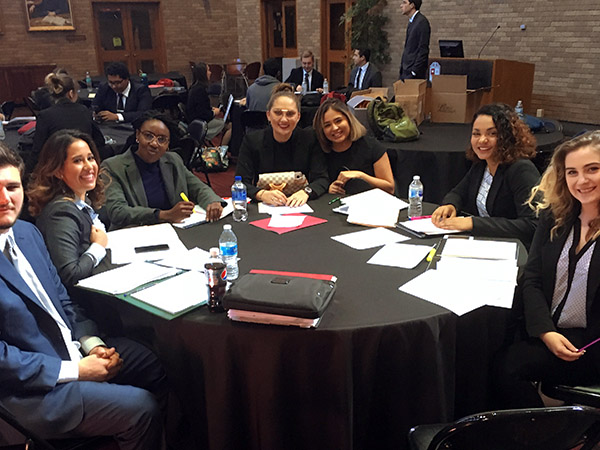 Students sitting at a table preparing for a competitive event