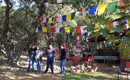 Students under Buddhist prayer flags