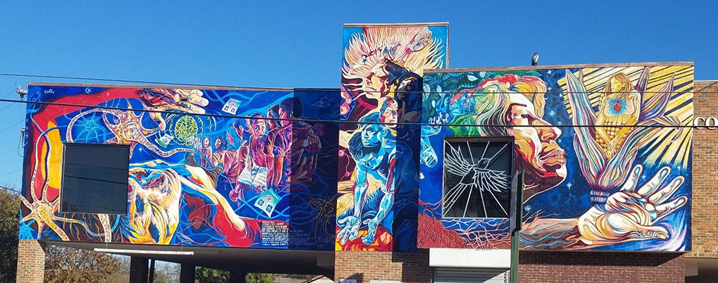 Several San Antonio murals depicting inequity.