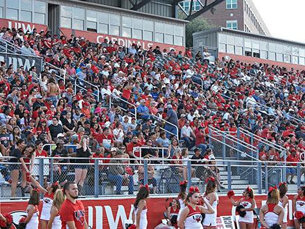a group of fans at a UIW soccer match