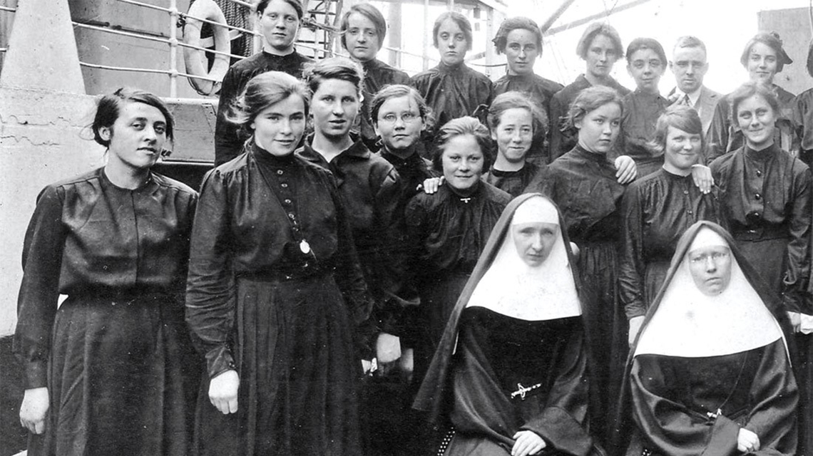 black and white of nuns on a boat