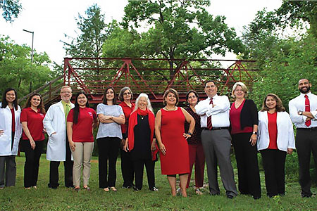 ECCL Leadership in front of a red bridge