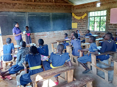 teacher working with students