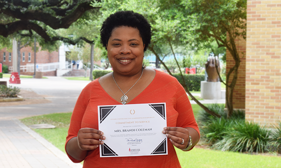 Brandi Coleman holding certificate