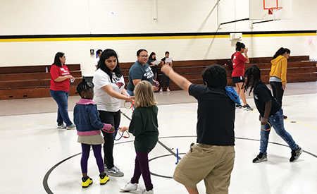 Children playing with students