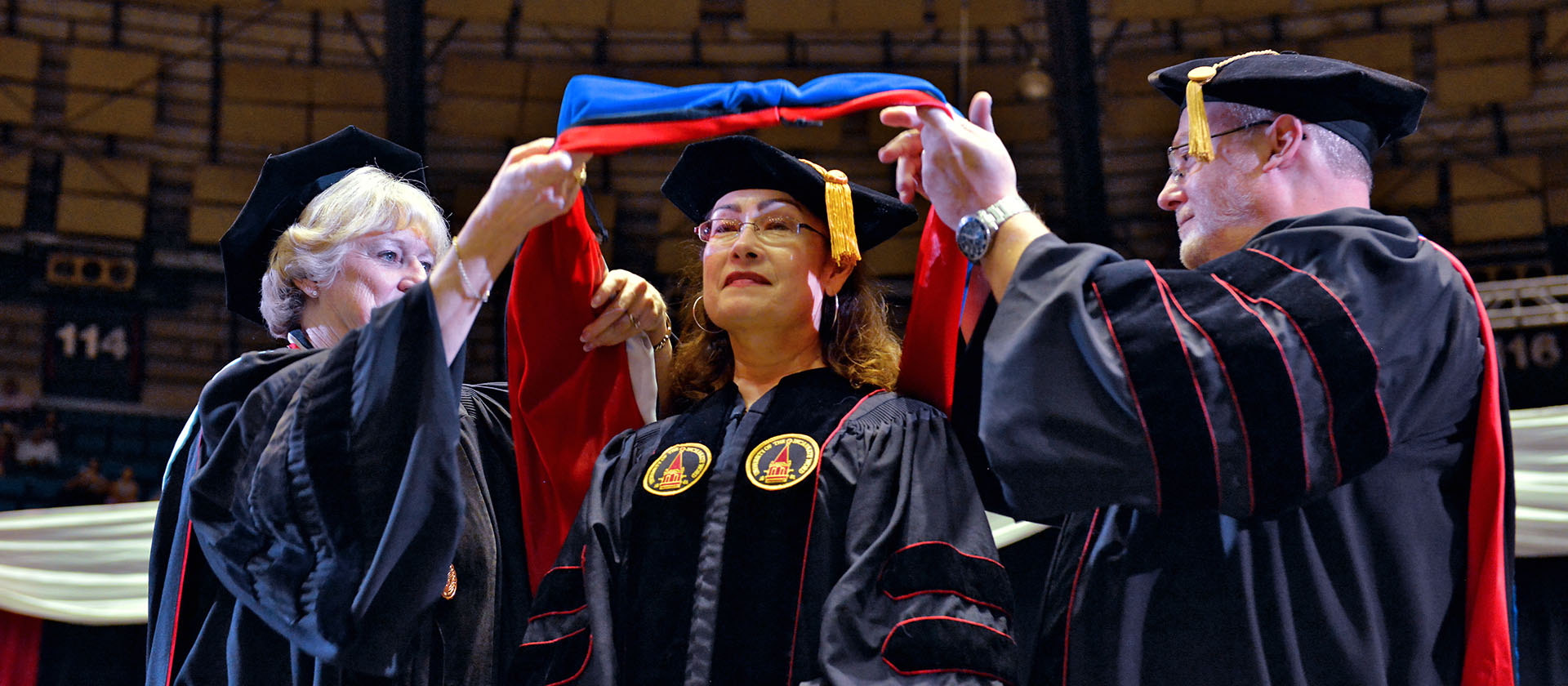 Student in graduation regalia during ceremony