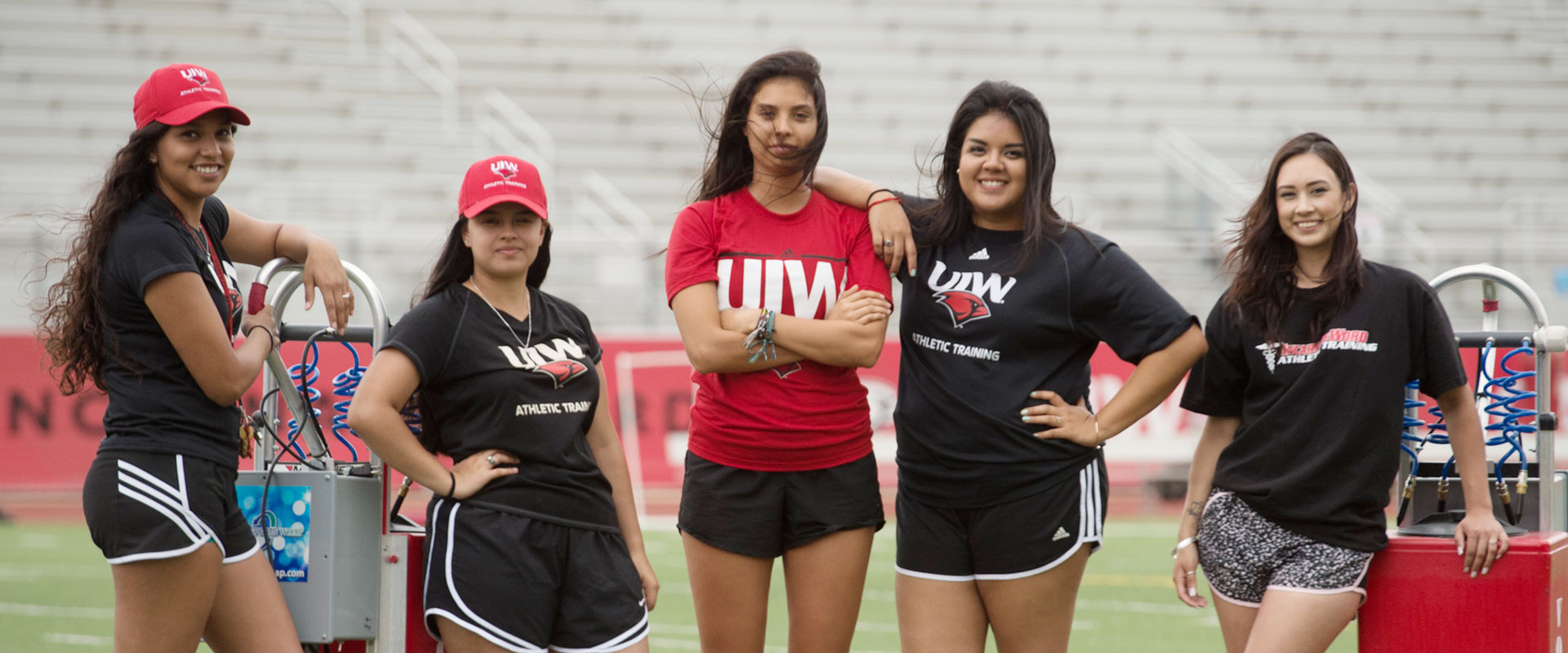 Athletic trainer students on the football field