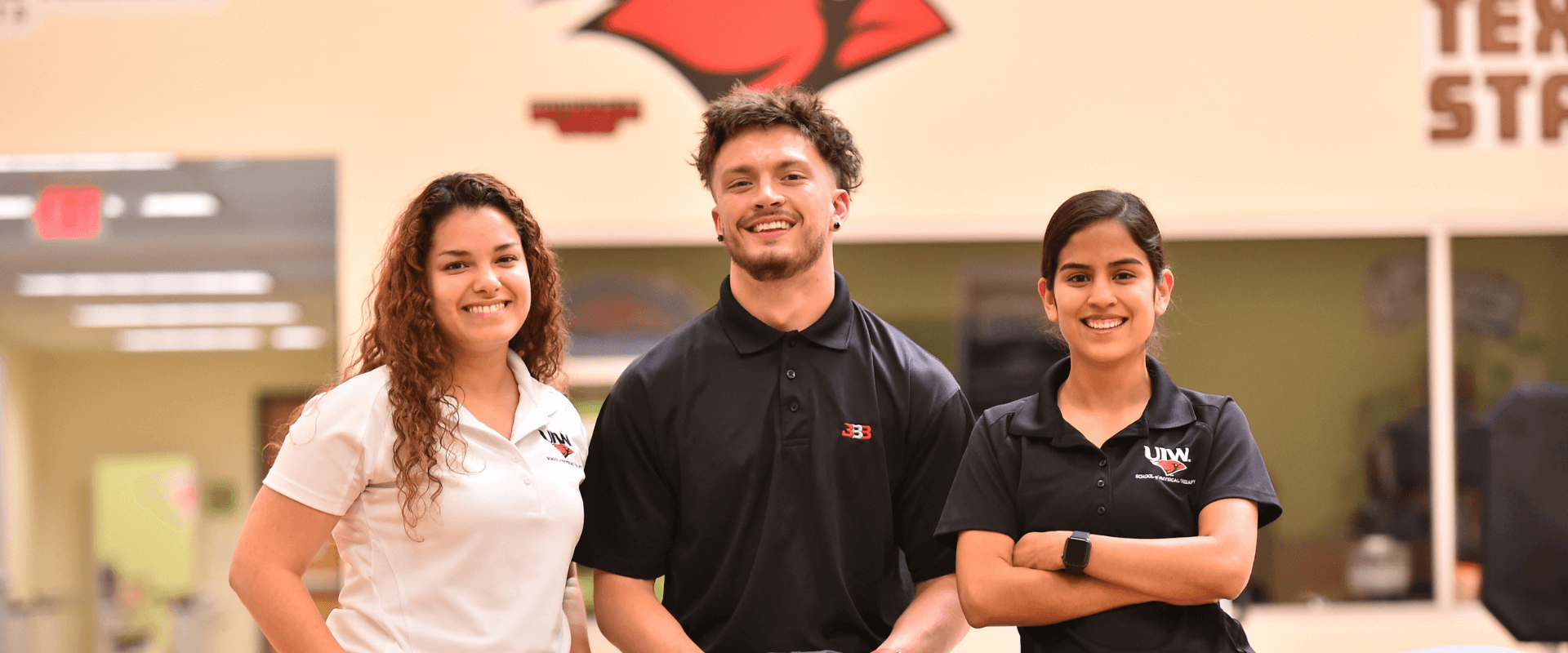 Three School of Physical Therapy Students standing in a group