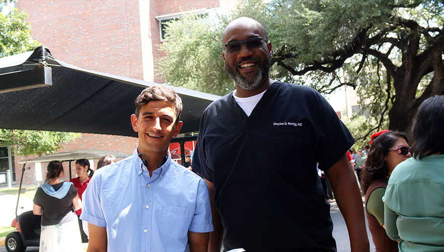 Two employees smiling