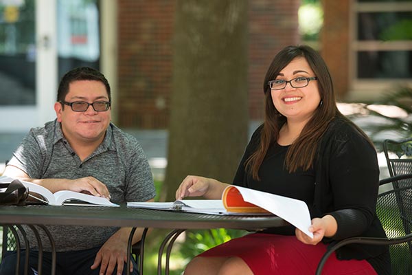 students sitting outside