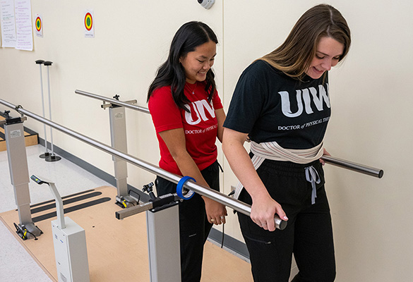 Instructor with a student giving an exam