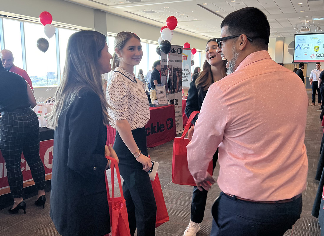 Students and presenters talking at the career fair