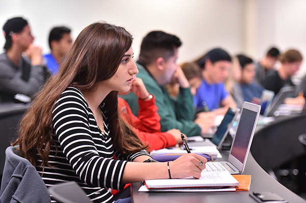 Student takes notes in class