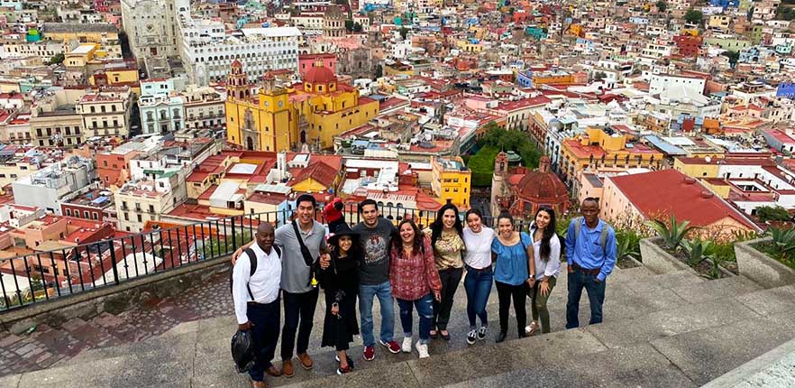 Students in front of Guanajuato, Mexico syline