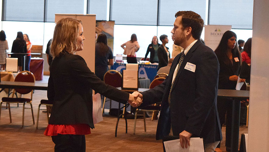 student and employer at career fair