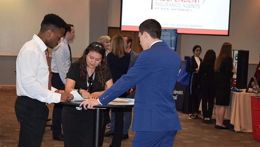 student and employer at career fair