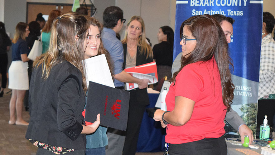 student and employer at career fair